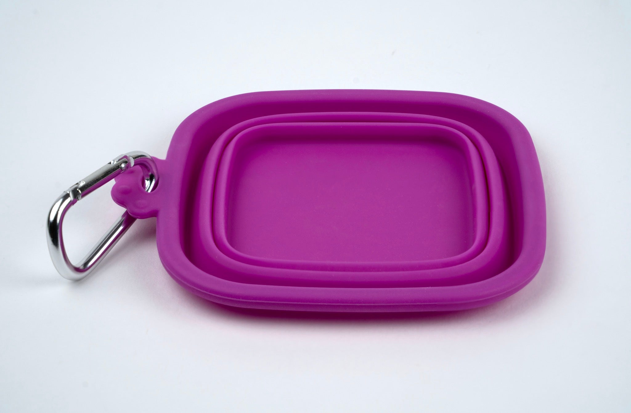 Purple silicone bowl with carabiner on a white background